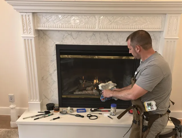 Port Chester Chimney Sweep performing fireplace maintenance in Port Chester, NY